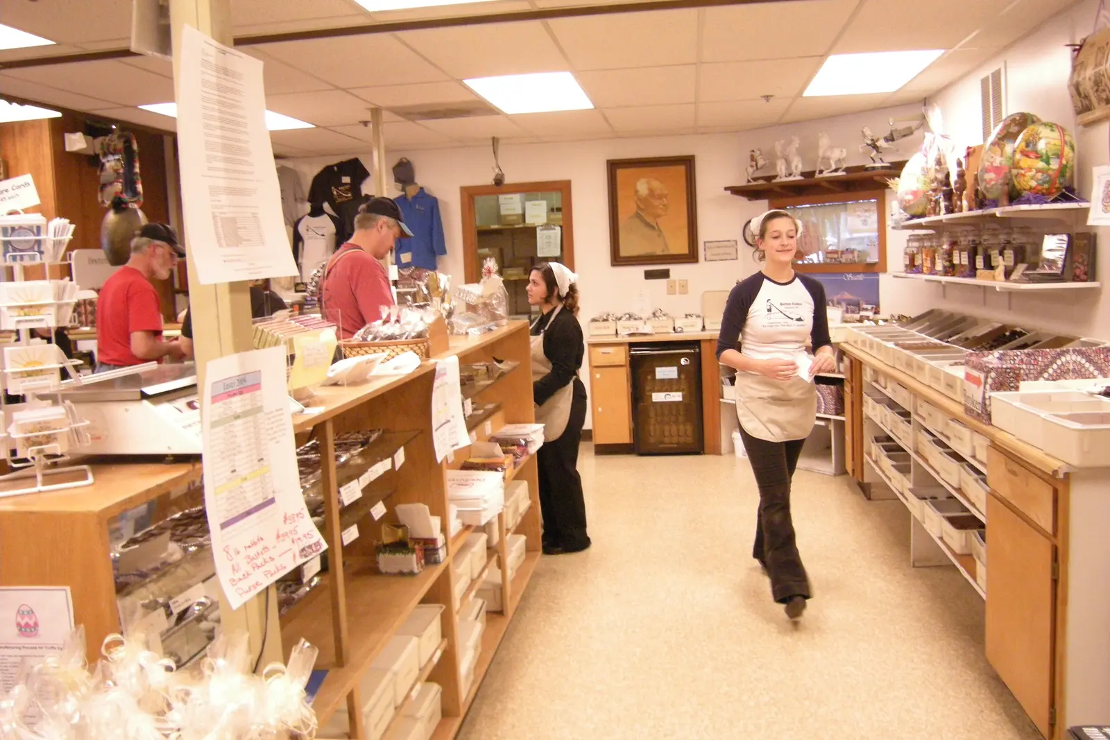 Employees and customers inside a real specialty candy shop