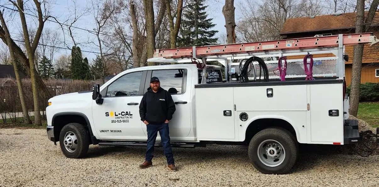 Sol-Cal Construction owner standing beside the company service truck