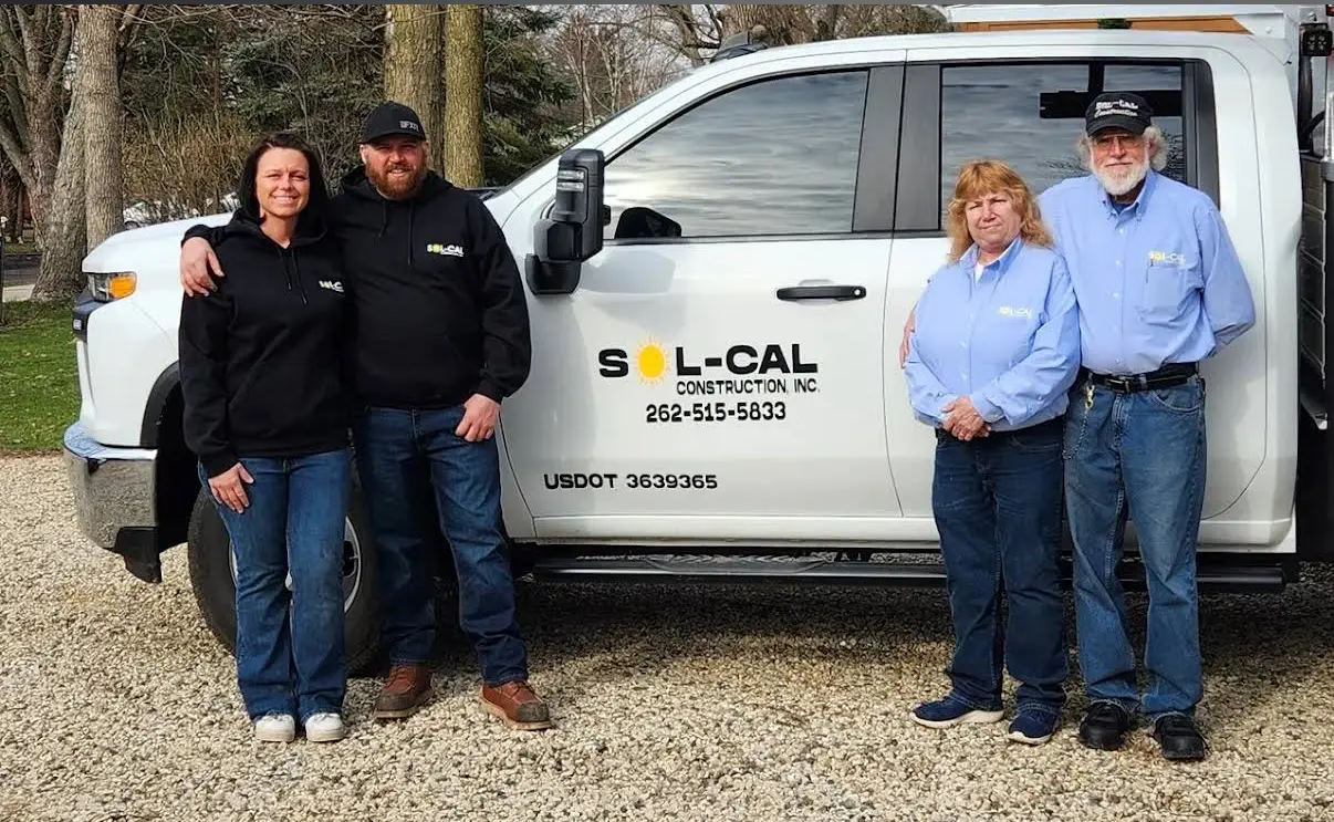 The Sol-Cal Construction crew standing beside a branded company truck