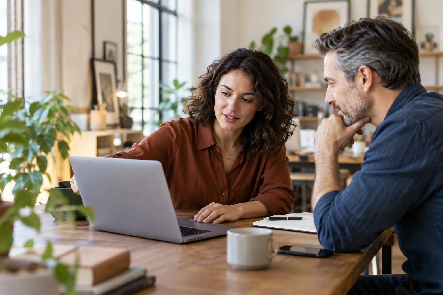 Professional and client reviewing options together at a laptop