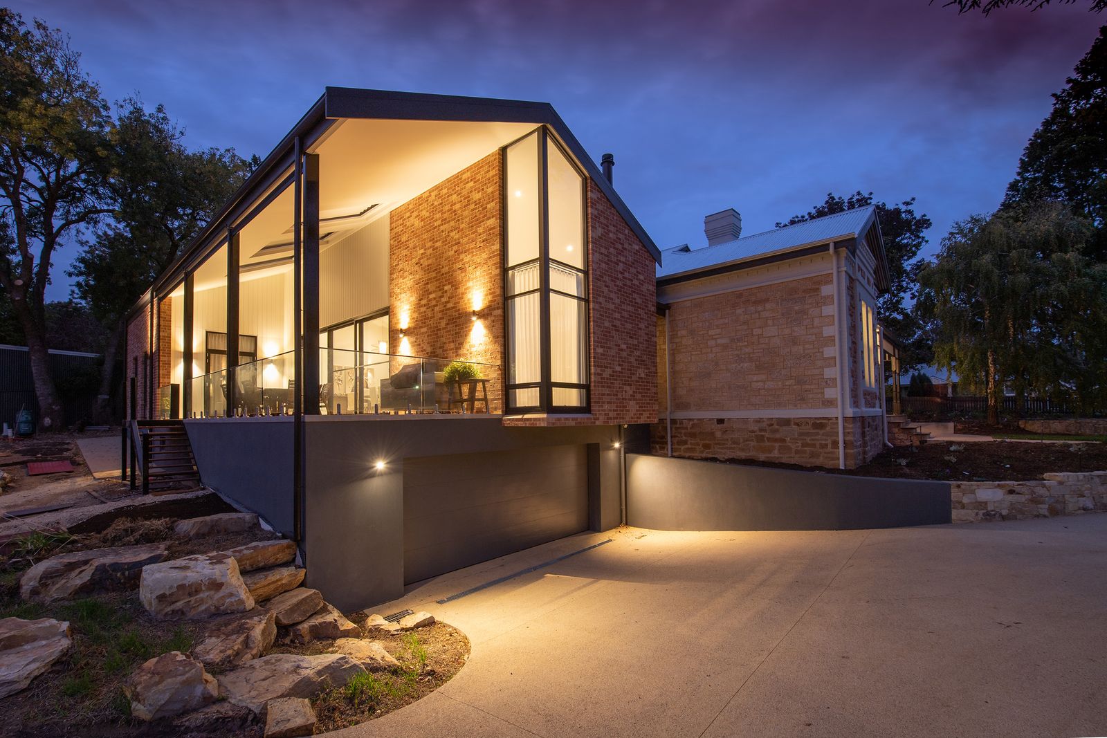 Illuminated modern house exterior, illustrative photography